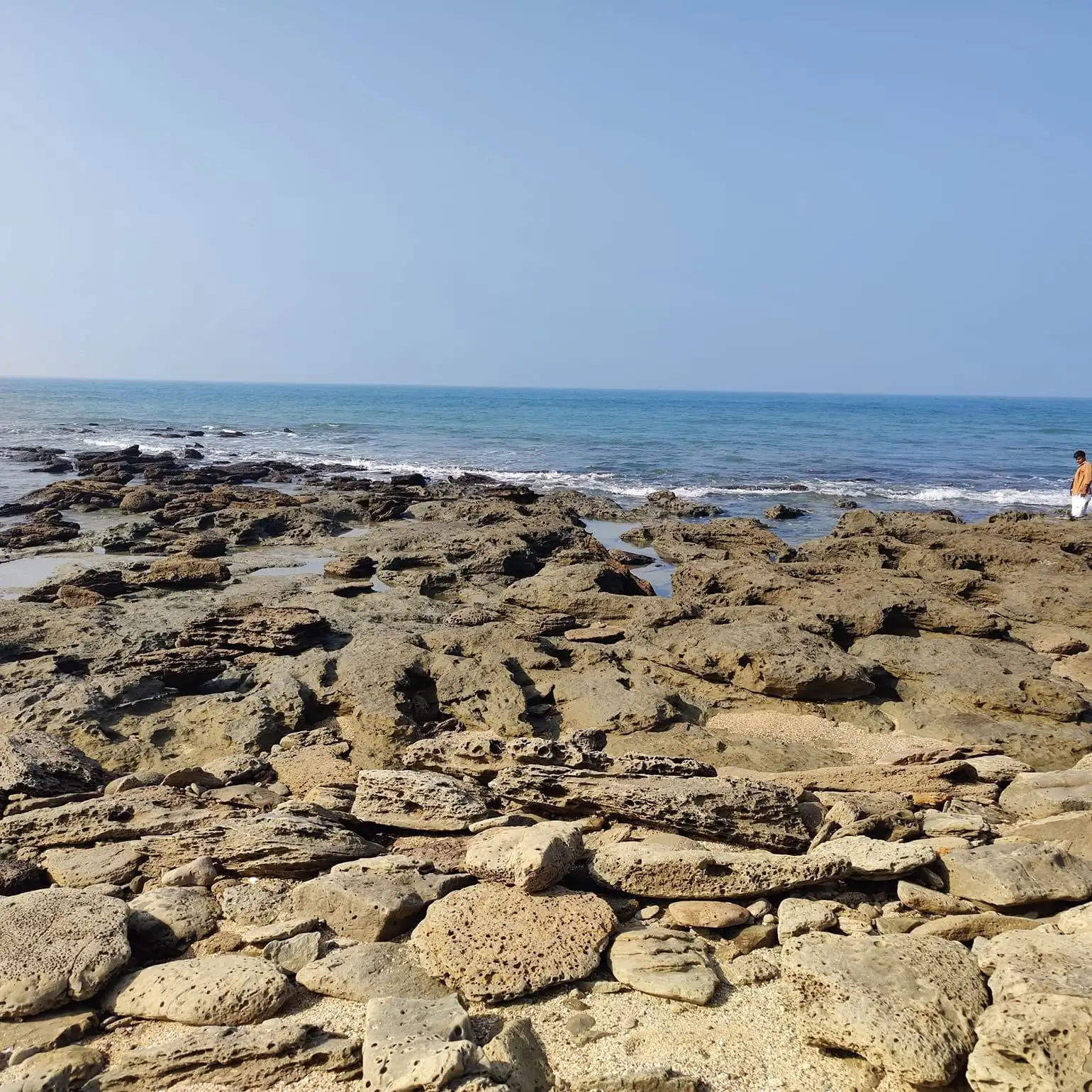 Rocky beach and clear sea on a sunny day