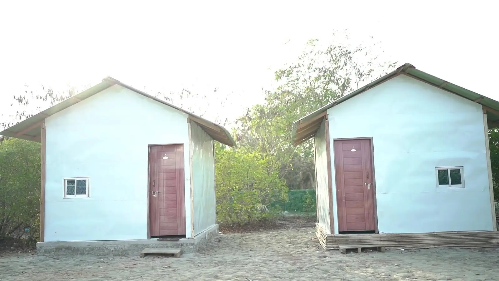 Two one-storey single cottages side by side